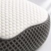 Close-up of the OrthoCloud Pillow’s honeycomb-knit fabric and breathable mesh cover
