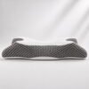 Side profile of the OrthoCloud Pillow showing its dual-height ergonomic contour