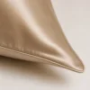 Close-up of the finished Champagne silk pillowcase corner and sewn edge