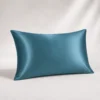 Moonlight Blue Ovio Mulberry Silk Pillowcase on a warm neutral studio background