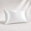 Pearl White Ovio Mulberry Silk Pillowcase on a warm neutral studio background